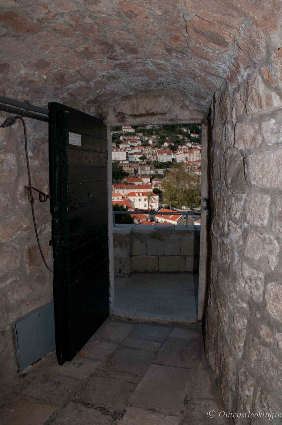 View of Dubrovnik through an open door in the walls